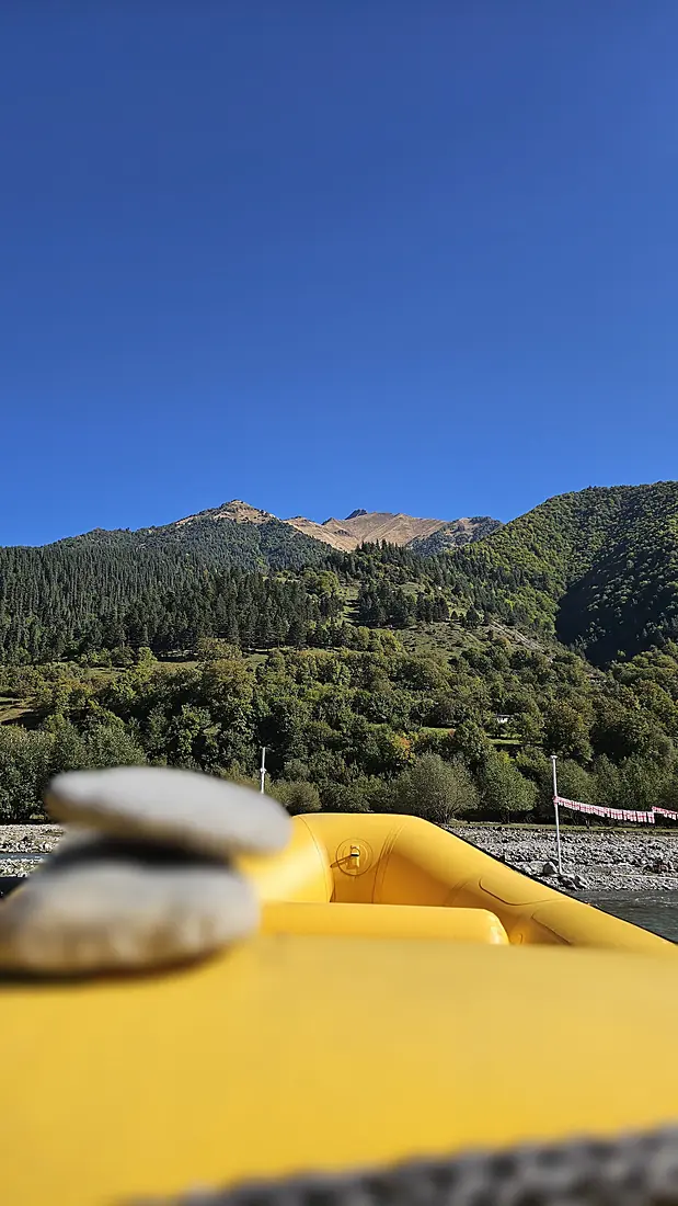Pebbles balanced on a raft by the river