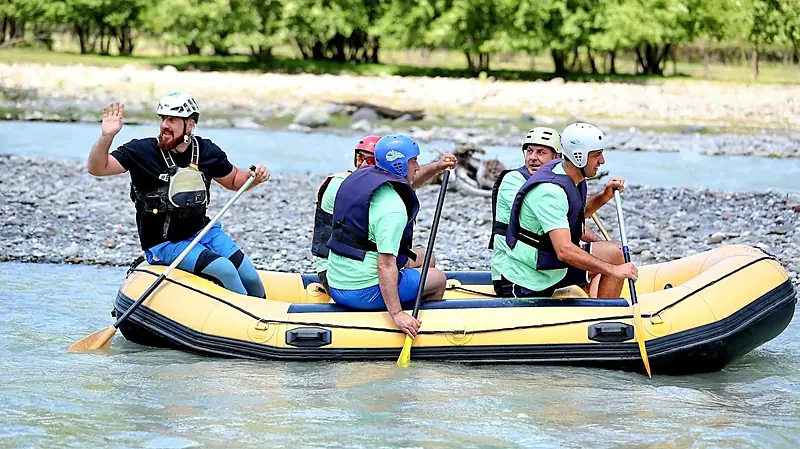 Rafters celebrating with paddles up on the White Aragvi near Tbilisi
